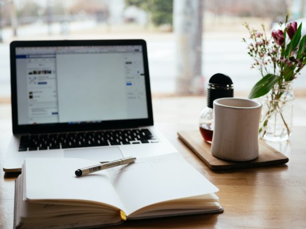 laptop and book on desk