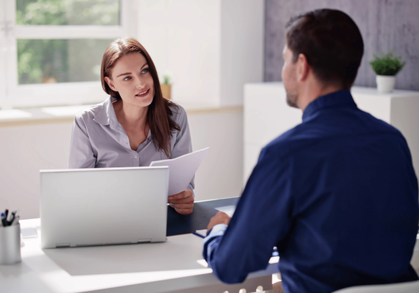 professional tax accountant in london ontario discussing tax returns with client